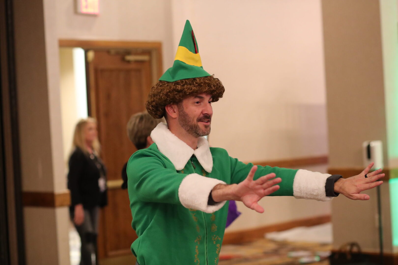 A man in green elf costume and hat